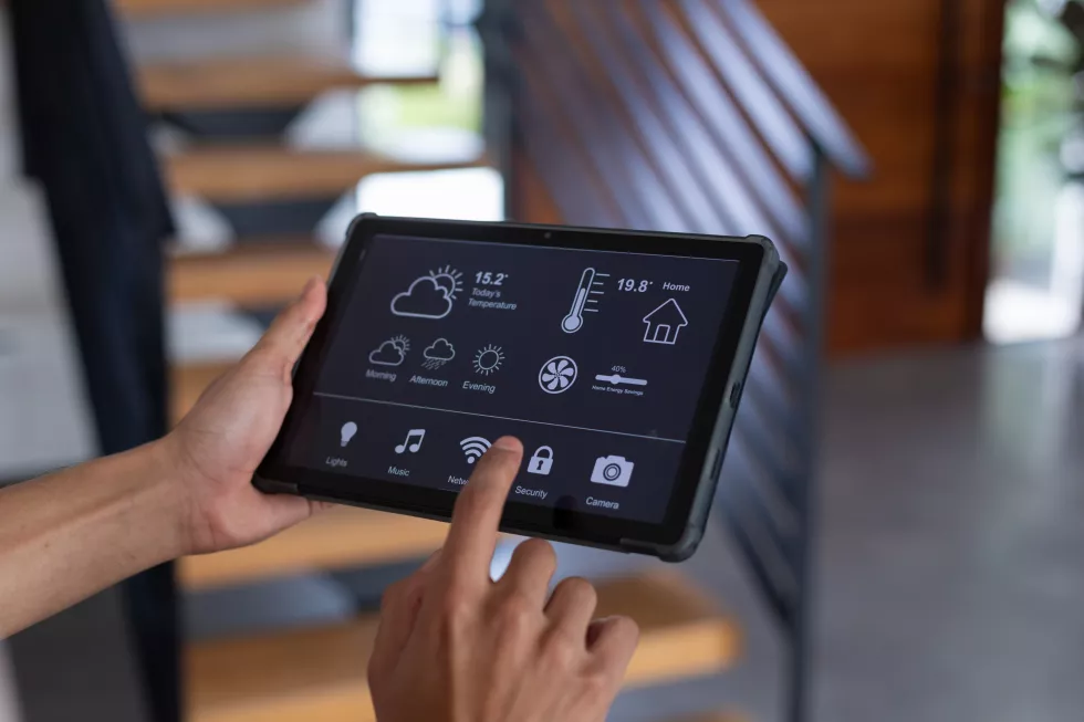 hands-biracial-man-home-using-tablet-with-smart-home-interface-screen-communication-technology-domestic-life-concept