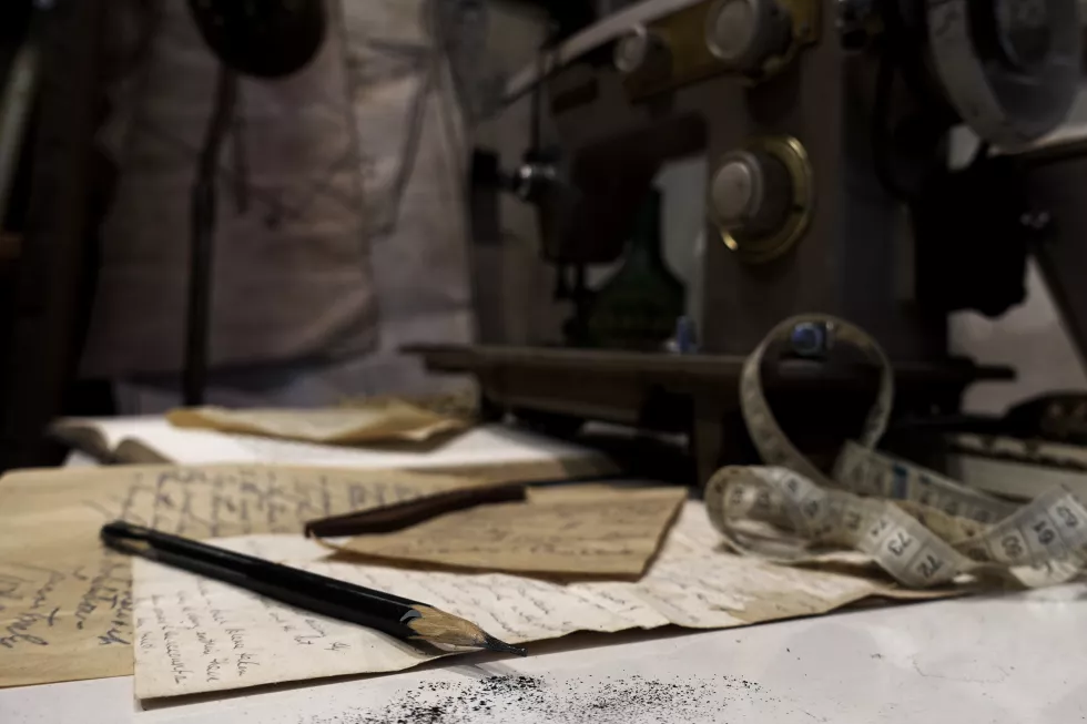 close-up-old-papers-pencil-table