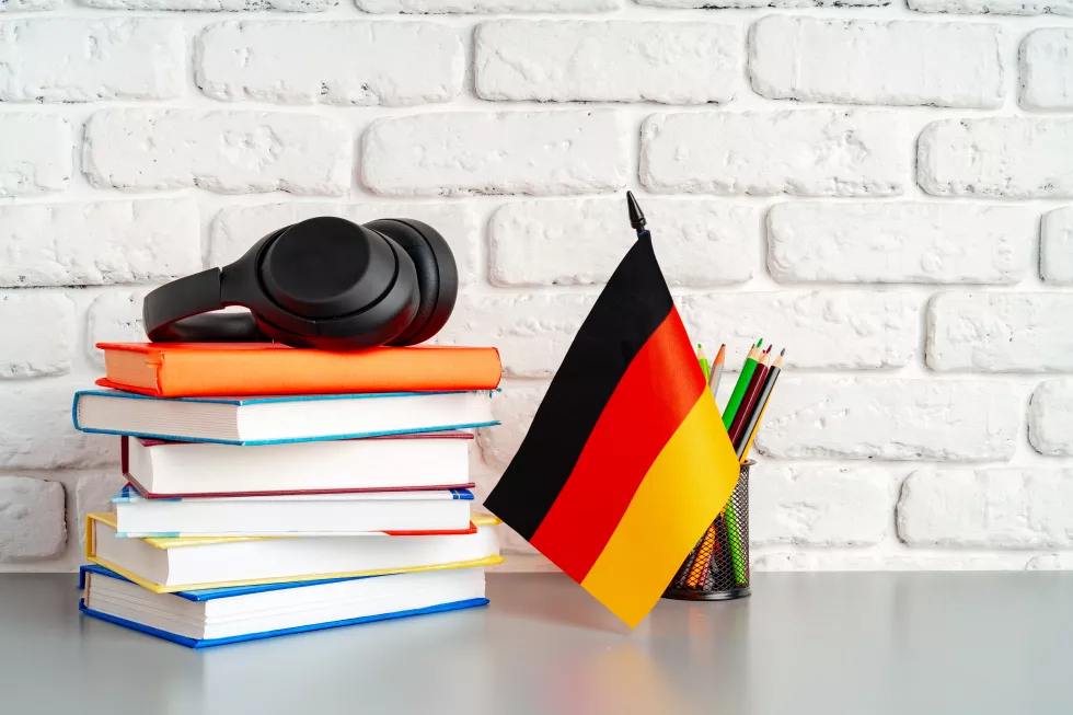 stack-books-flag-germany-desk-german-language-learning-concept