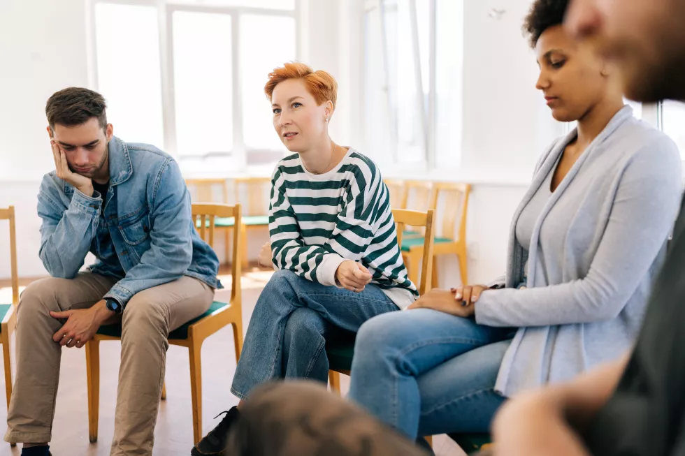 portrait-positive-young-woman-talking-sharing-emotions-with-companionate-patients
