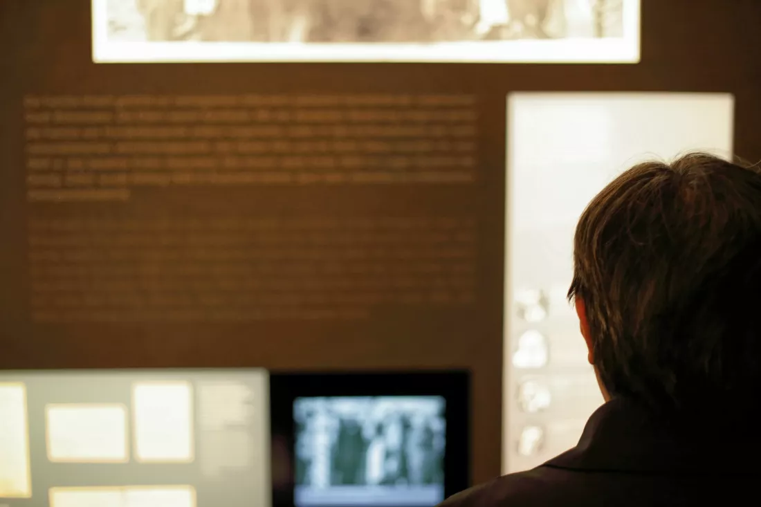 rear-view-man-against-information-board