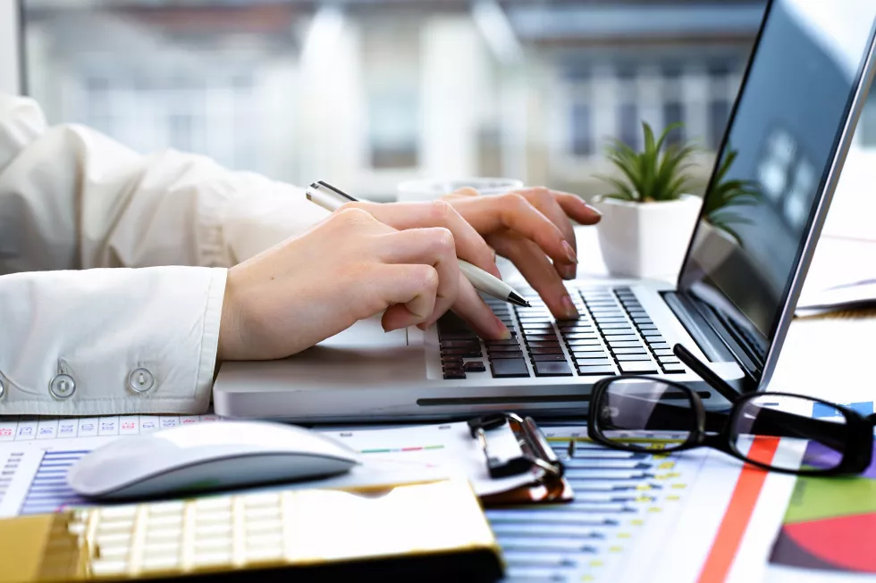 businesswoman-works-with-items-doing-business-office