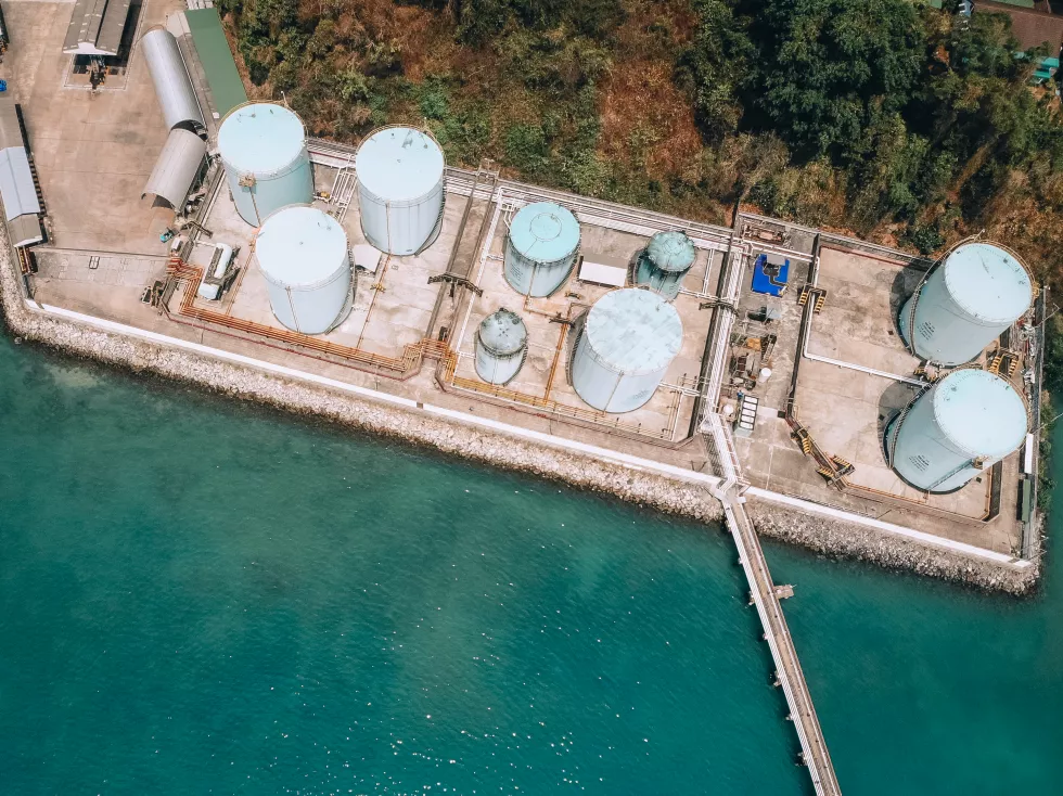 oil-depot-terminal-seashore-long-oil-pipe-steel-containers-aerial-view-technology-concept