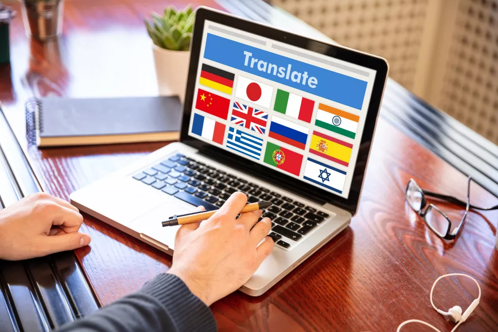 man-working-laptop-with-word-translate-computer-screen
