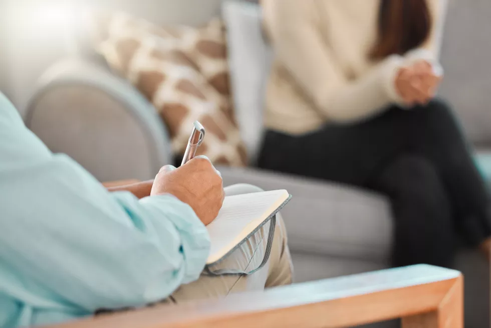 sofa-person-therapist-with-notebook-consultation-writing-notes-support-client-mental-health-therapy-patient-psychologist-with-review-counseling-listen-help-session