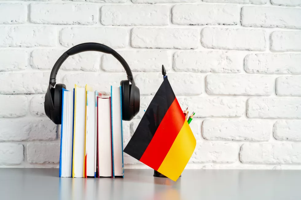 stack-books-flag-germany-desk-german-language-learning-concept(1)