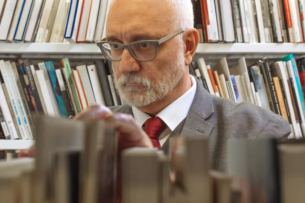close-up-librarian-looking-books-shelf-library
