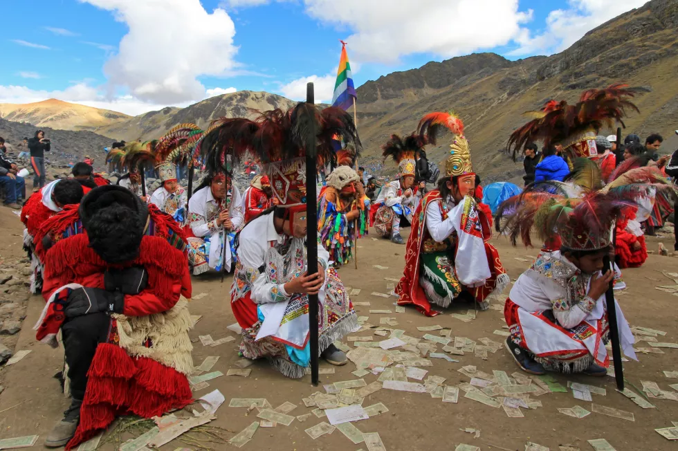 people-traditional-clothing-dancing-sand-against-mountains-sky