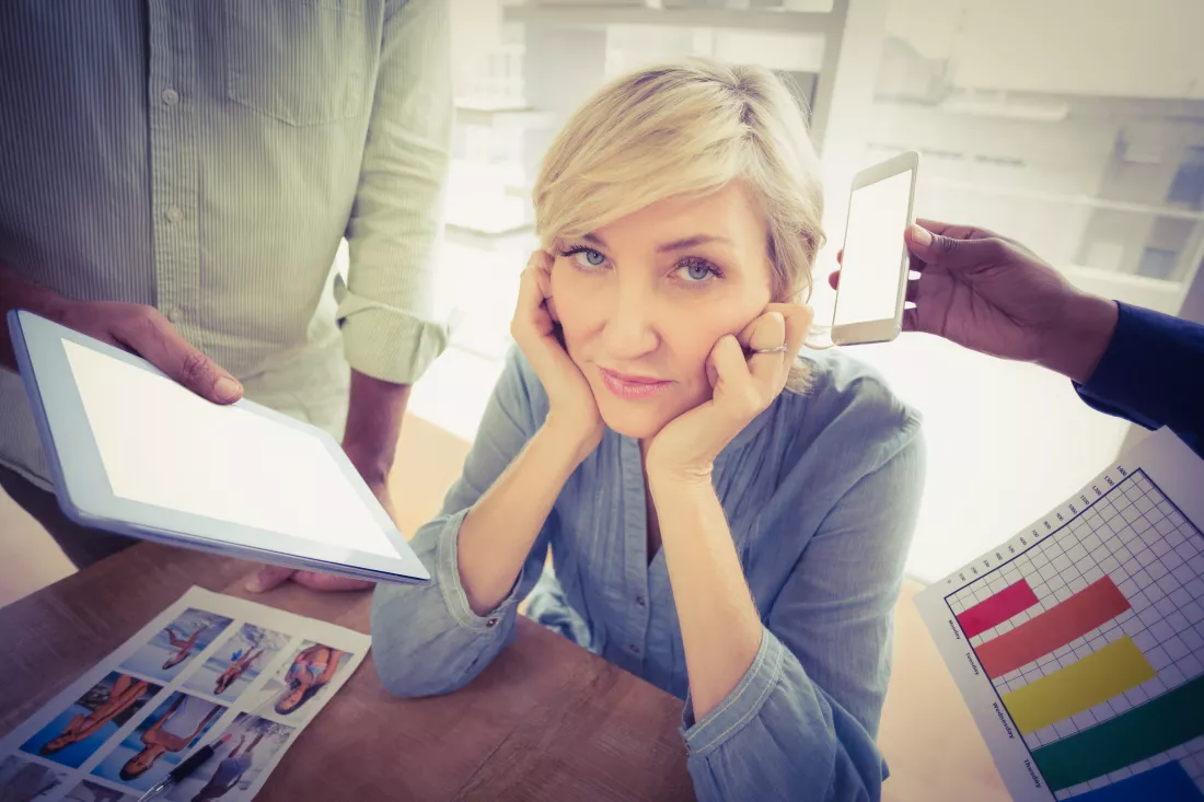 overwrought-businesswoman-covering-her-ears