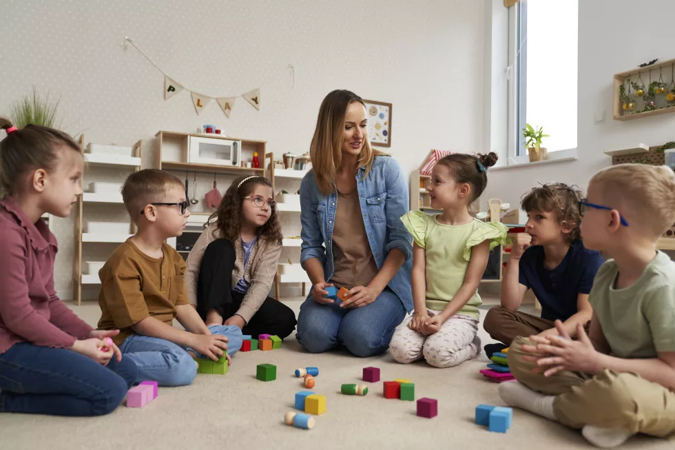 teacher-performs-exercises-children