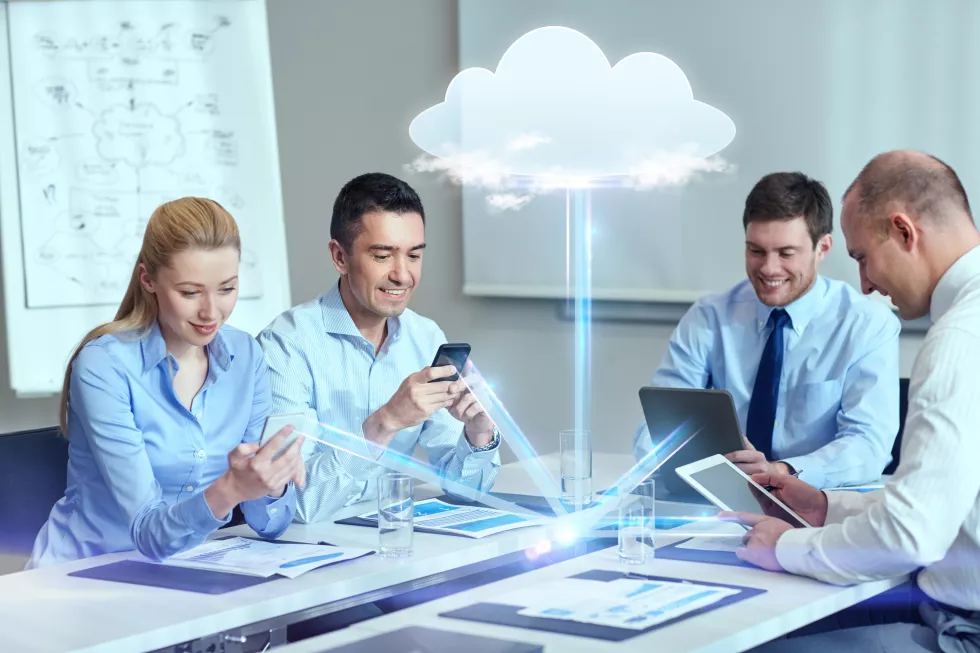 business-people-cloud-computing-technology-concept-smiling-business-team-with-smartphones-tablet-pc-computers-working-office