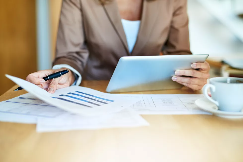 hands-documents-business-person-with-data-desk-graphs-charts-financial-statistics-office-corporate-digital-tablet-employee-kpi-update-economy-growth-review-paperwork