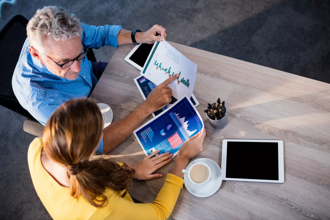 two-coworkers-analyzing-documents(1)
