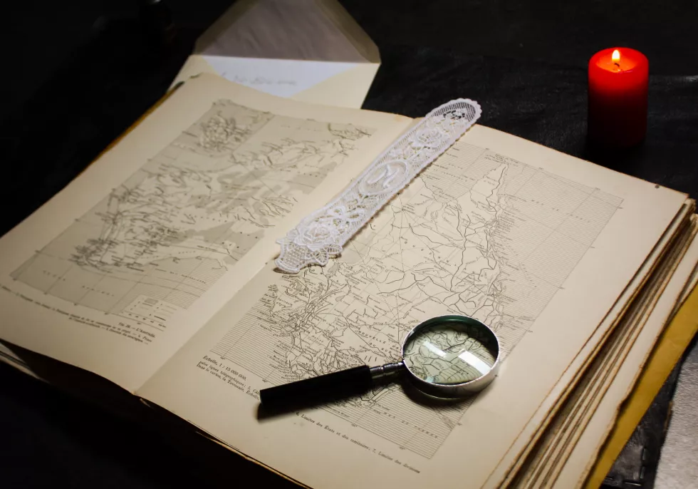 high-angle-view-magnifying-glass-world-map