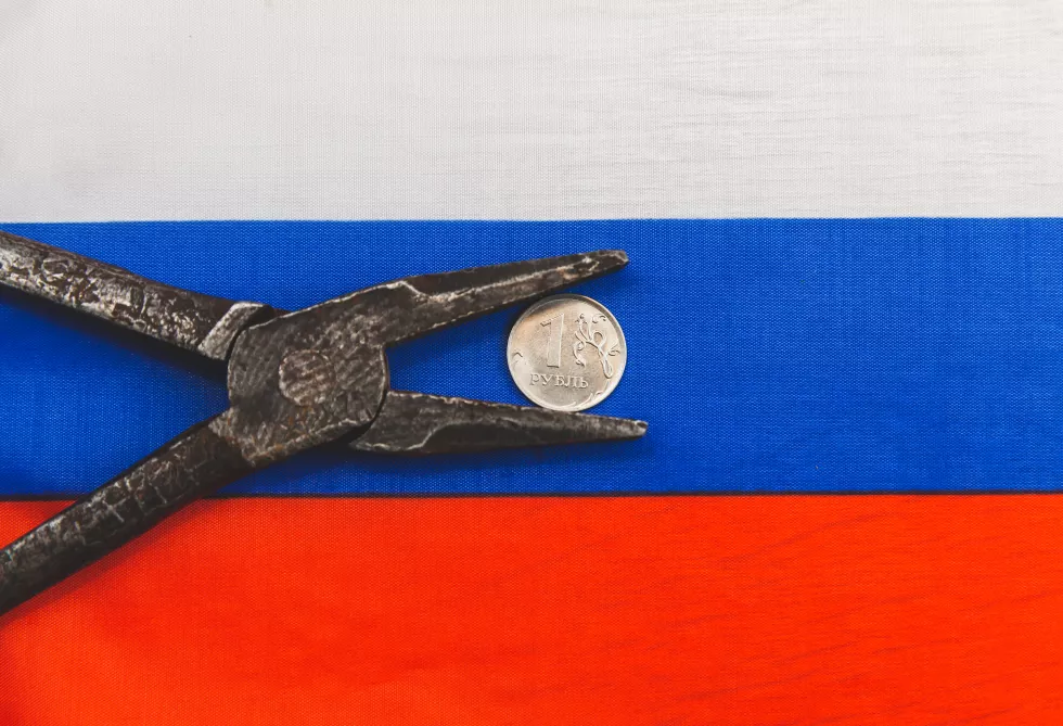 one-russian-ruble-coin-old-pliers-concept-crisis-russia-sanctions-against-russian-economy