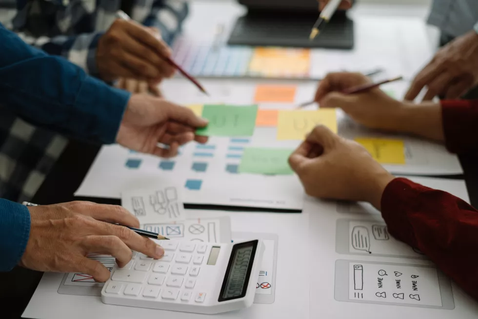 ui-designer-brainstorming-about-mobile-app-interface-wireframe-design-with-customer-breif-color-code-office