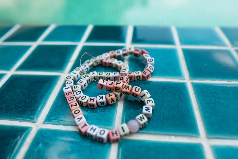 close-up-view-text-bracelet-pool-deck