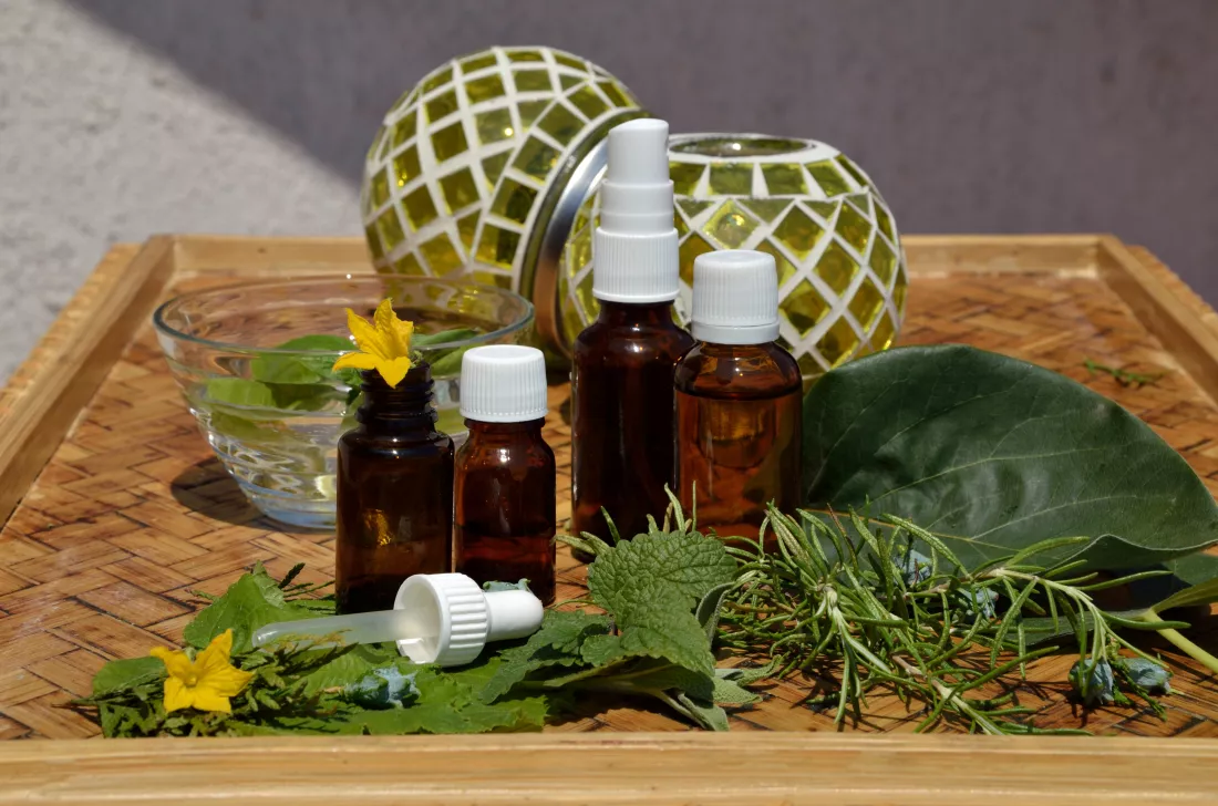 bottles-homeopathy-remedies-with-fresh-remedy-plants-wooden-table