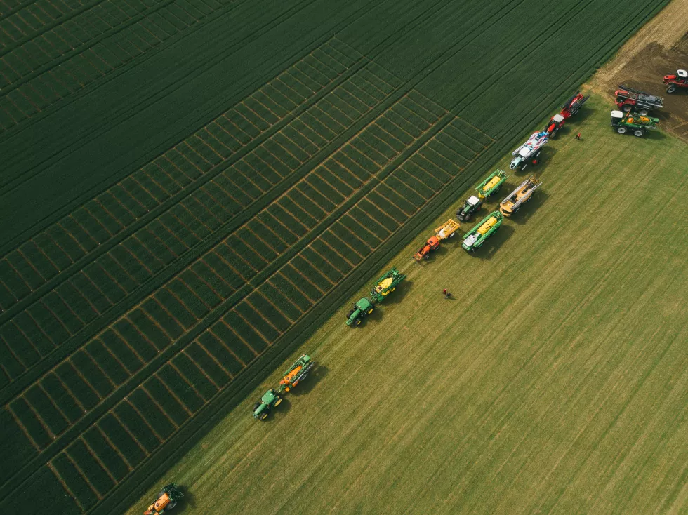 aerial-view-machinery-working-agricultural-field(1)