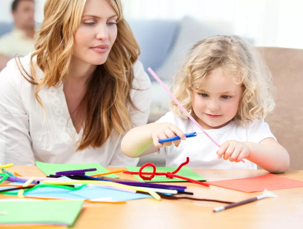 woman-her-daughter-cutting-paper