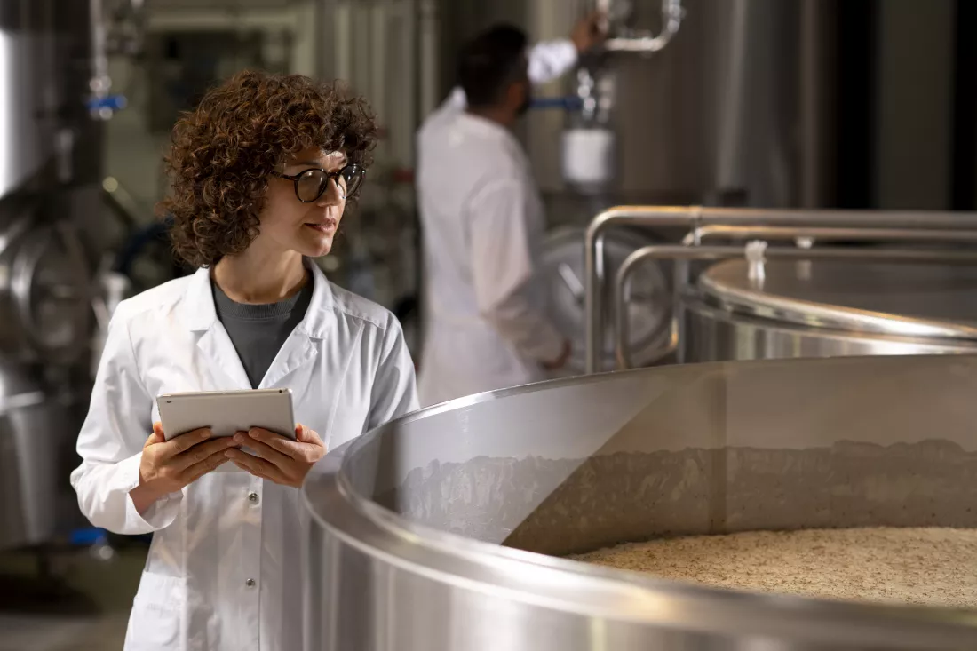 medium-shot-woman-working-beer-factory