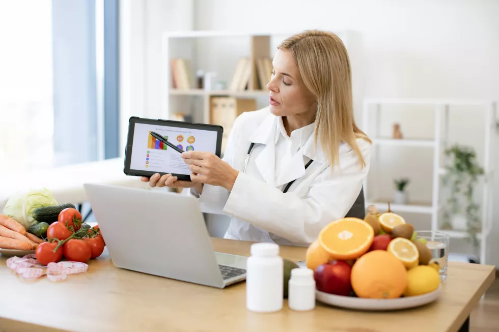 confident-lady-doctors-coat-getting-presentation-laptop