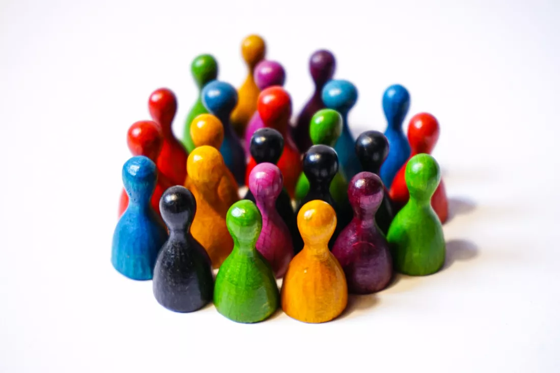 close-up-multi-colored-meeples-white-background