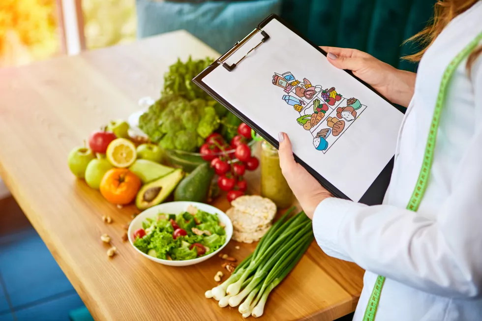 holding-schematic-meal-plan-diet-with-various-healthy-products-background