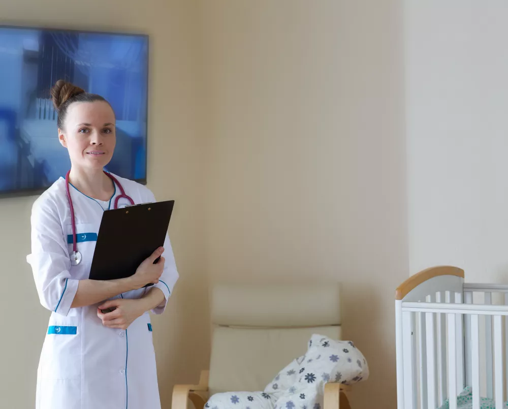 smiling-young-doctor-professional-uniform-postnatal-ward