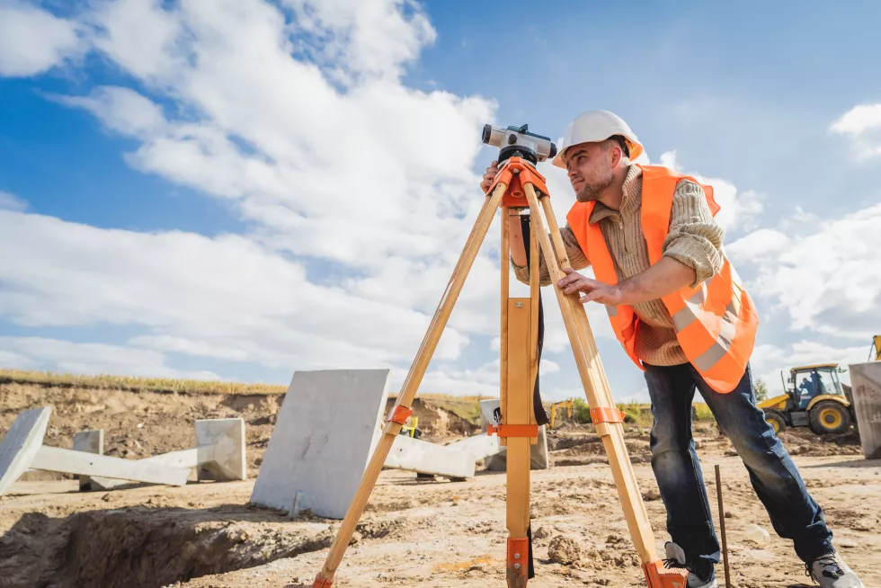 surveyor-worker-with-theodolite-equipment-construction-site
