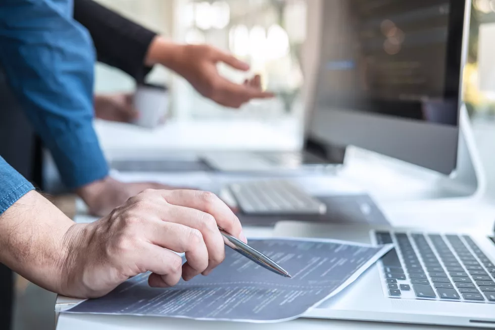 close-up-man-using-laptop-table