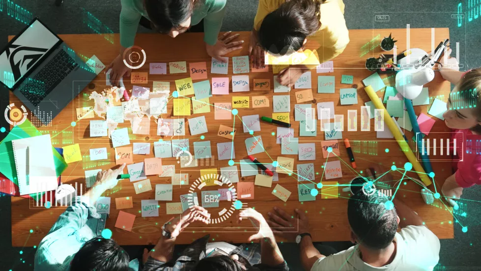 top-view-business-team-looking-laptop-screen-sharing-idea-symposium