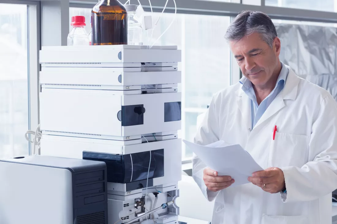 scientist-standing-lab-coat-reading-analysis