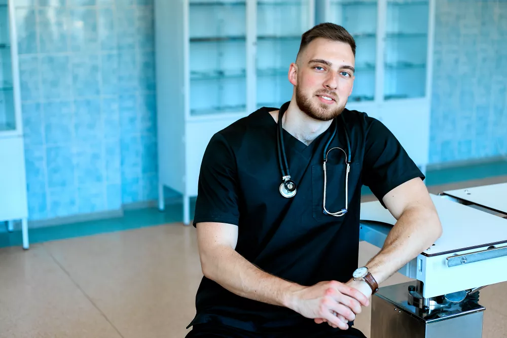 confident-strong-smiling-veterinarian-poses-operating-room-near-surgical-table