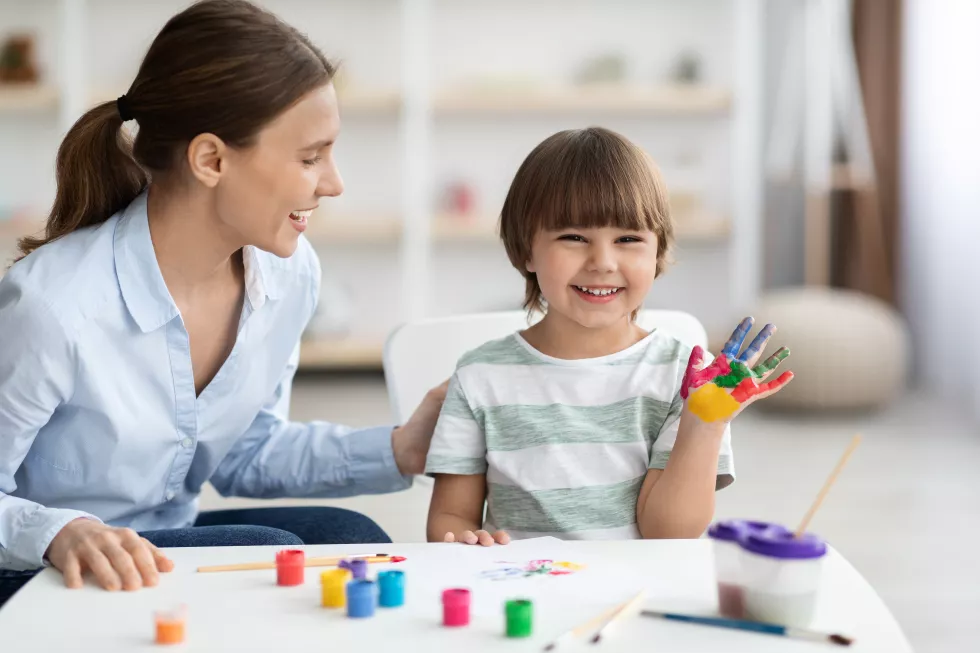 art-classes-children-happy-little-boy-with-colorful-painted-palm-showing-hand-camera