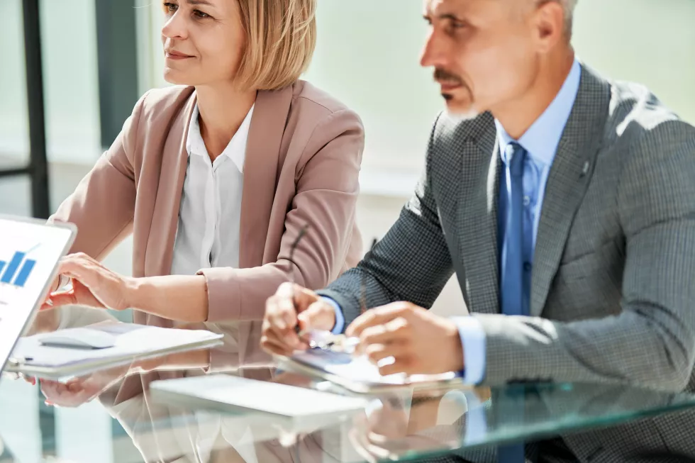 business-partners-sitting-office-desk