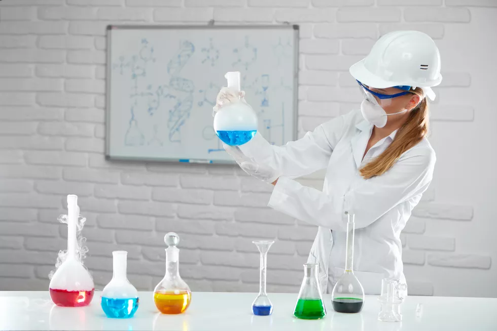 young-woman-analyses-chemical-liquids-tubes