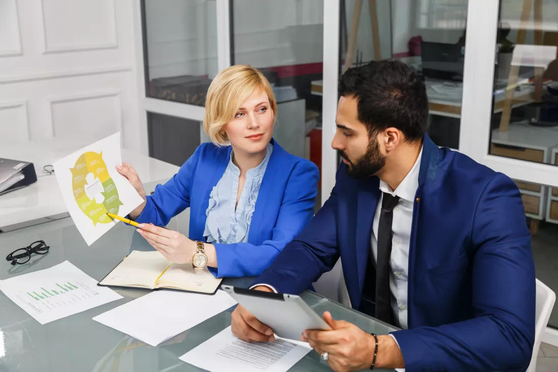 analytic-manager-team-working-process-bearded-man-blonde-businesswoman-dressed-suits-work-with-documents-white-office-interior