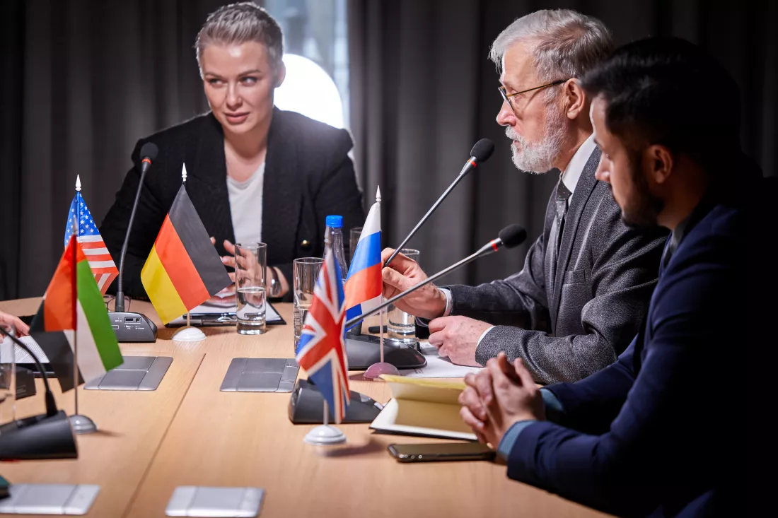 female-delegate-formalwear-looking-audience-giving-speech-report-multi-ethnic-conference-meeting-boardroom-using-microphones