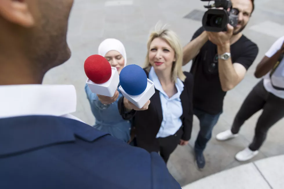 close-up-interviewee-with-microphone-taking-statements