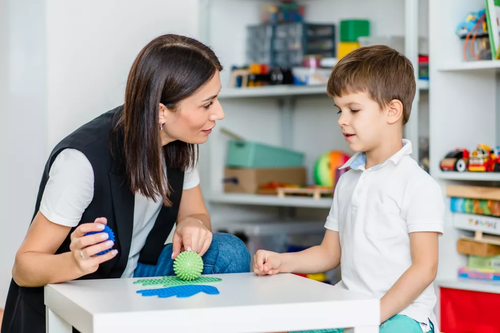 beautiful-woman-speech-therapist-deals-with-boy-teaches-him-correct-pronunciation-competent-speech