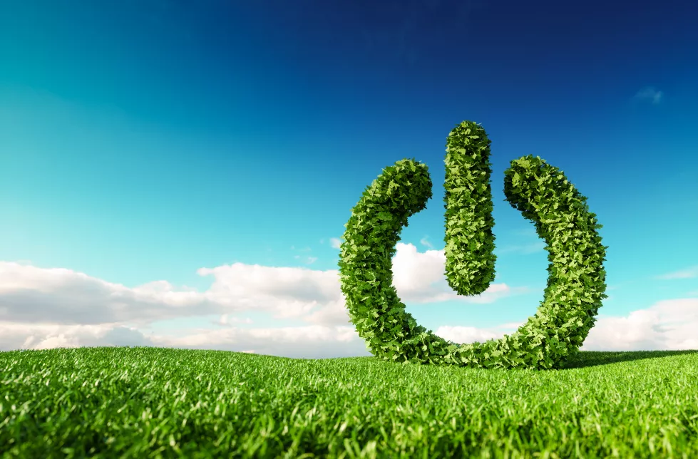 eco-friendly-renewable-energy-concept-3d-rendering-green-power-button-sign-fresh-spring-meadow-with-blue-sky-background