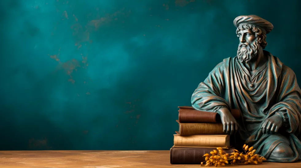 young-male-graduate-black-robe-marble-background