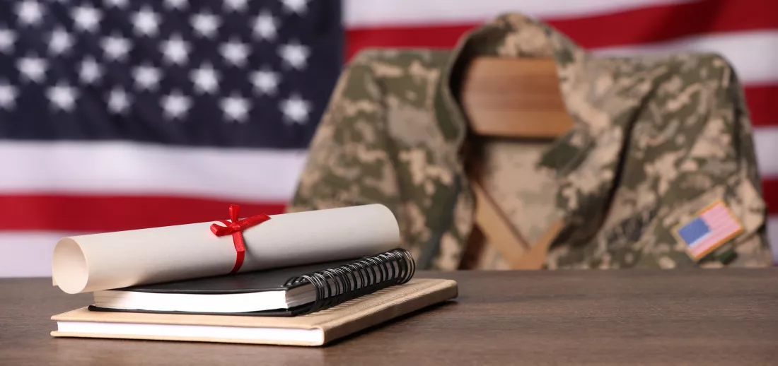 notebooks-diploma-wooden-table-chair-with-soldier-uniform-against-flag-united-states-indoors-military-education