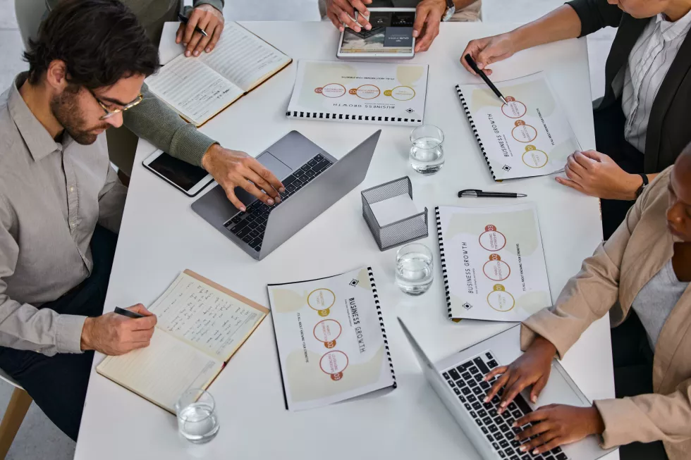 meeting-planning-hands-typing-laptop-with-documents-tax-audit-report-writing-financial-statement-accounting-business-people-strategy-finance-paperwork-logistics