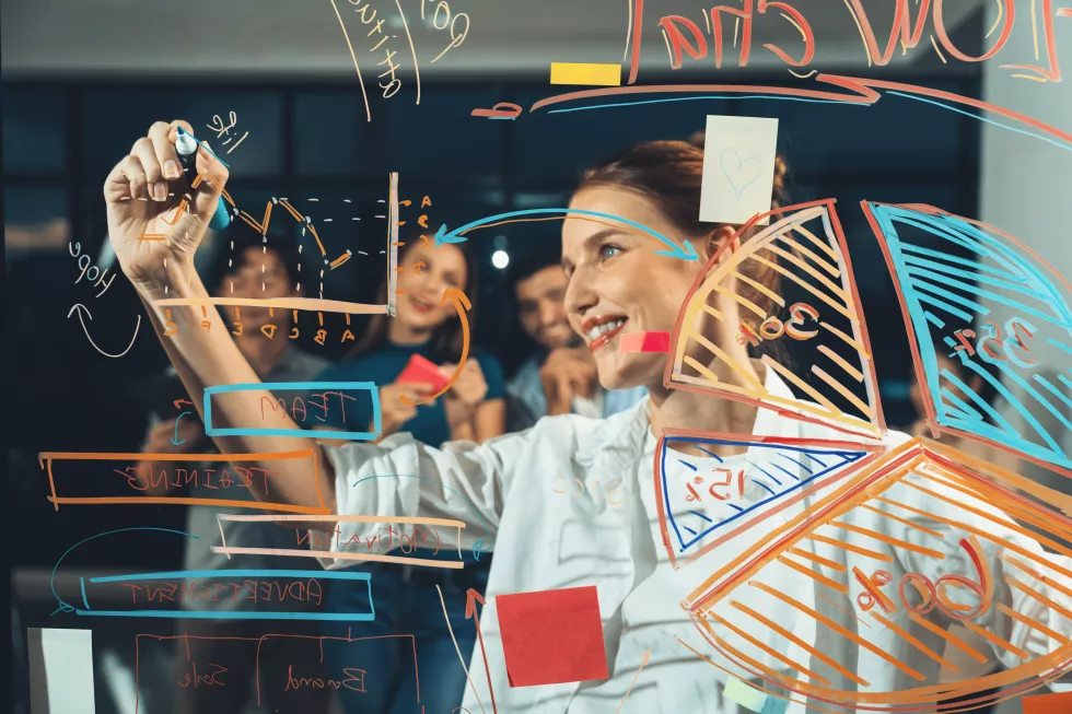 young-beautiful-businesswoman-writing-business-plan-glass-wall-tracery