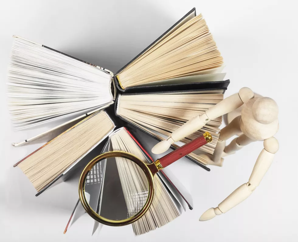 magnifier-wood-person-reading-studying-books-concept-knowledge-research