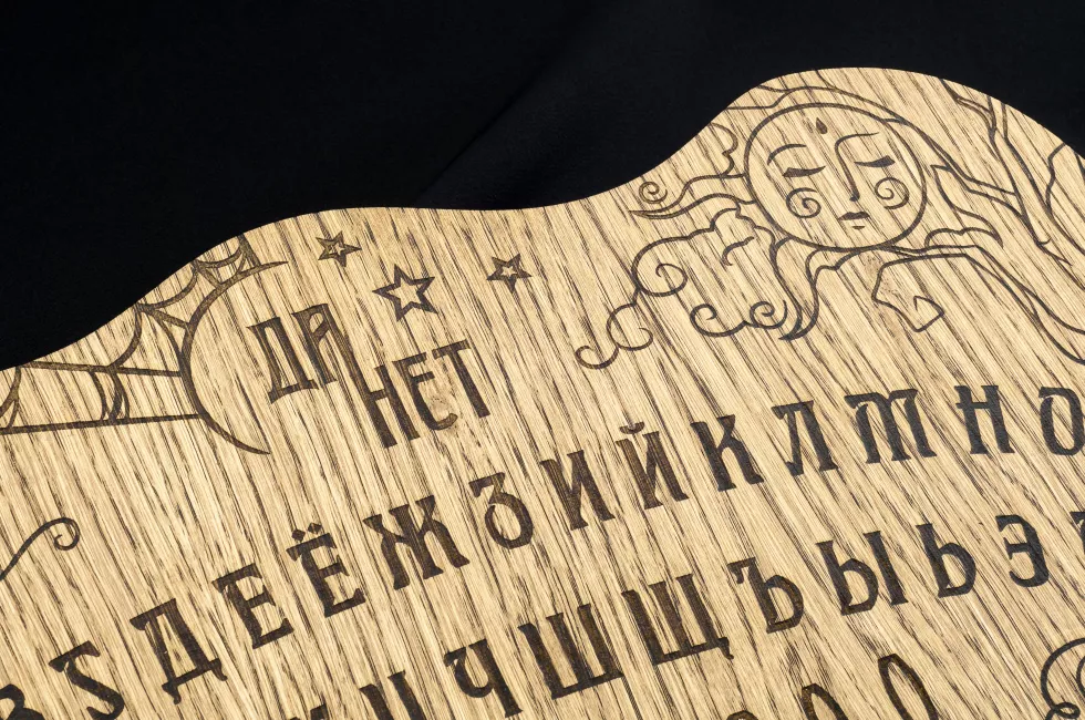 ouija-board-yellow-black-background