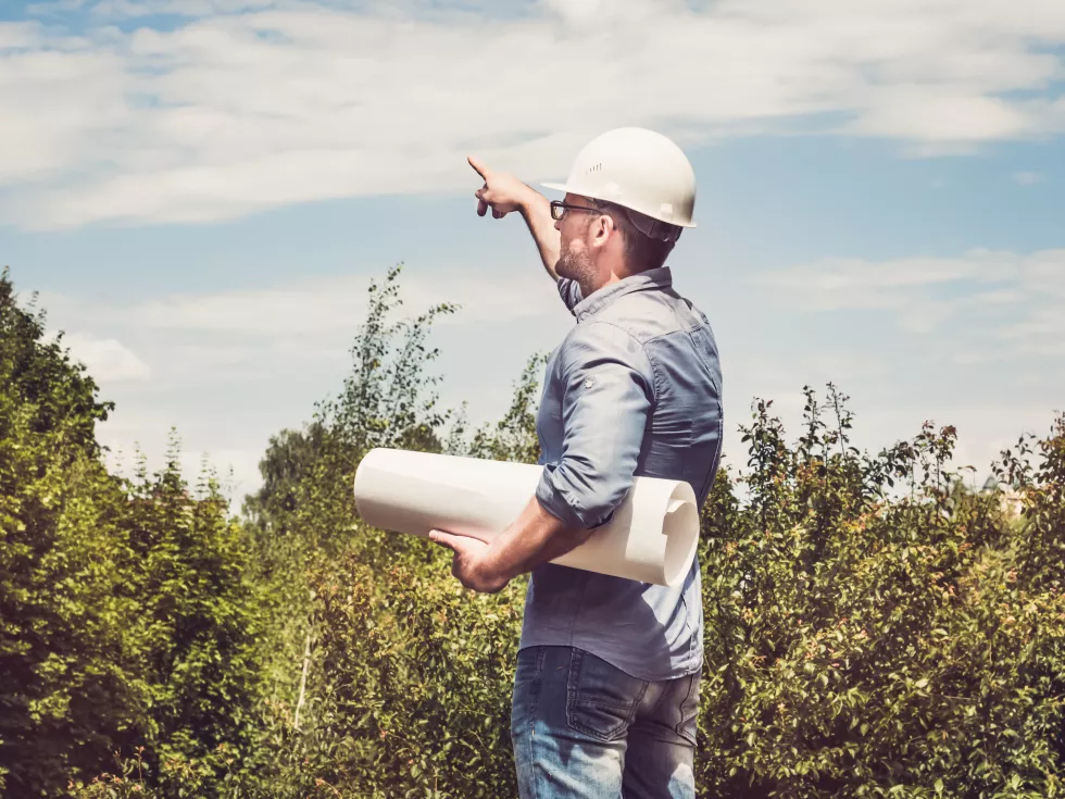 man-holding-paper-project-park