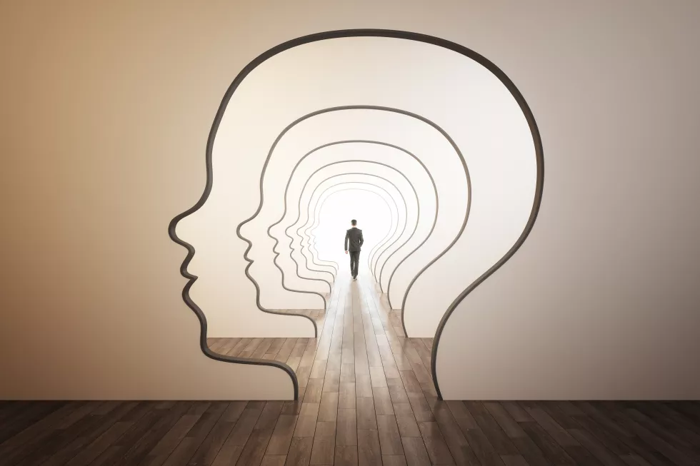 abstract-image-businessman-walking-through-head-outline-corridor-thinking-maze-solution-answer-search-concept
